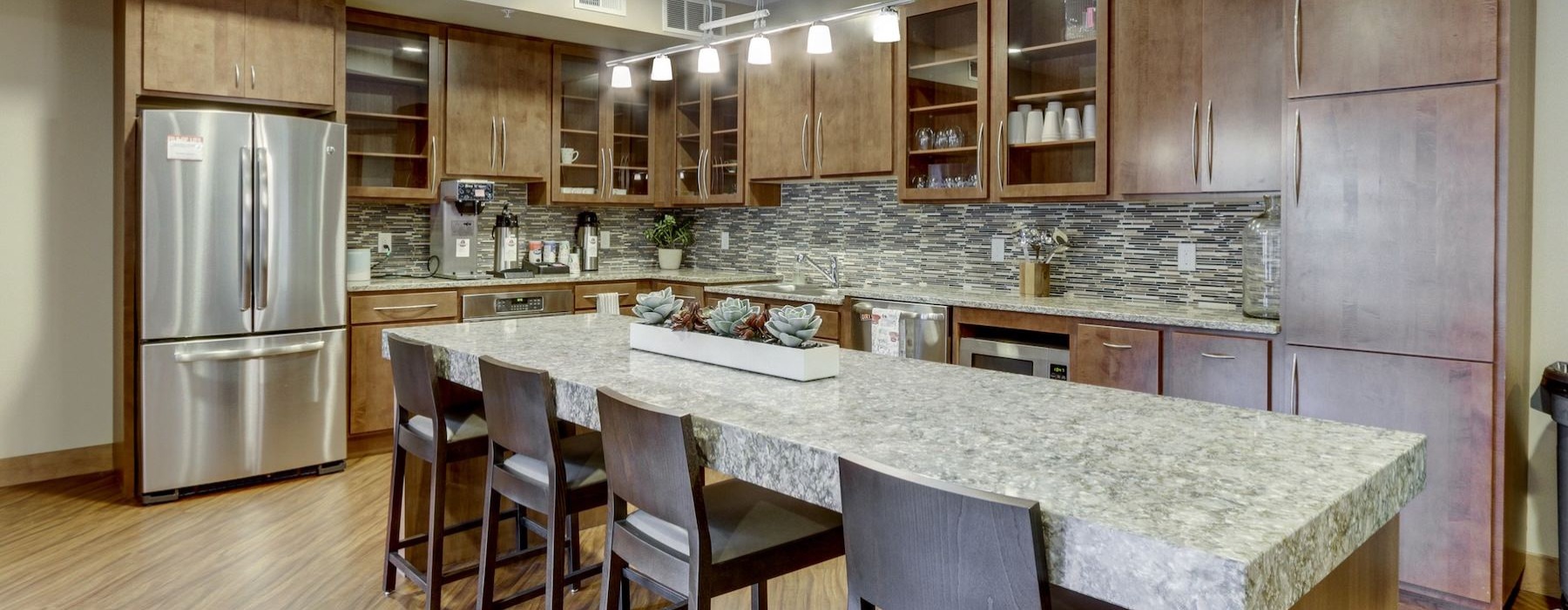 a kitchen with a marble counter