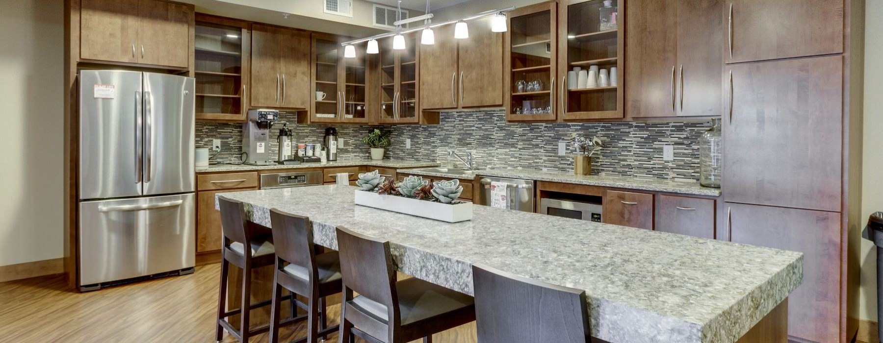 a kitchen with a marble counter