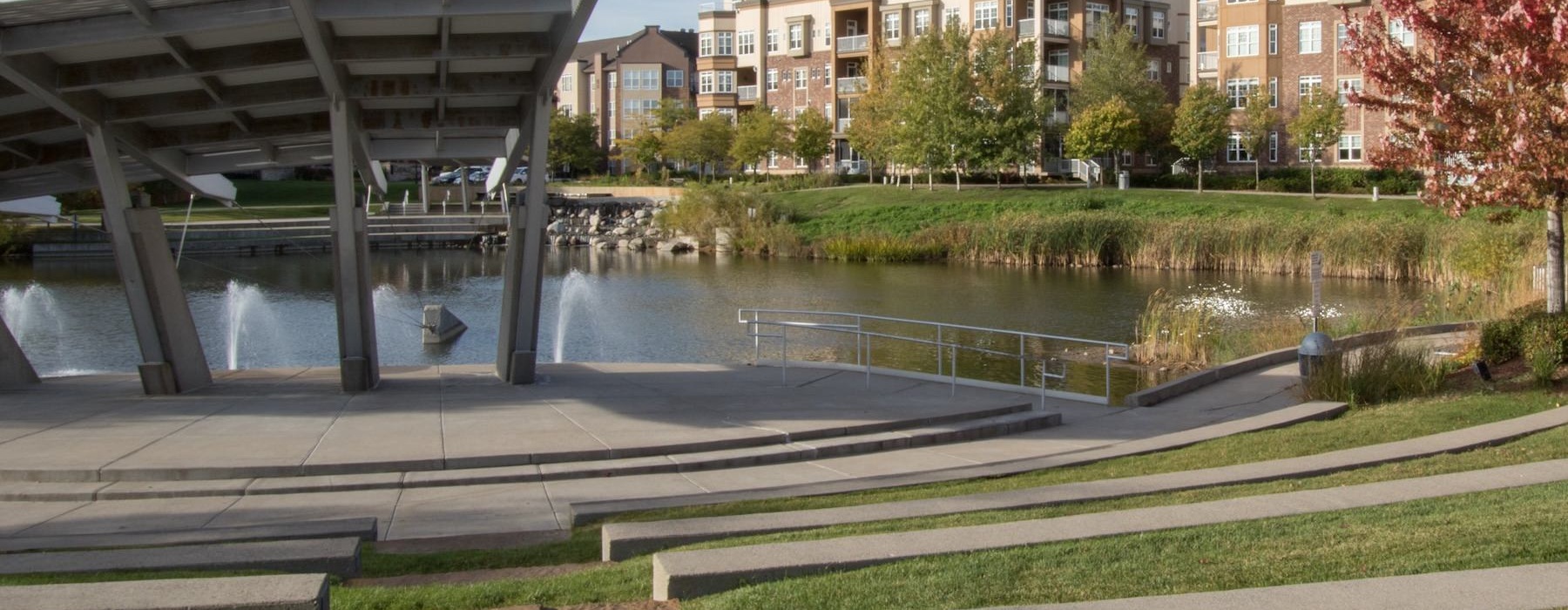a large water fountain in a park